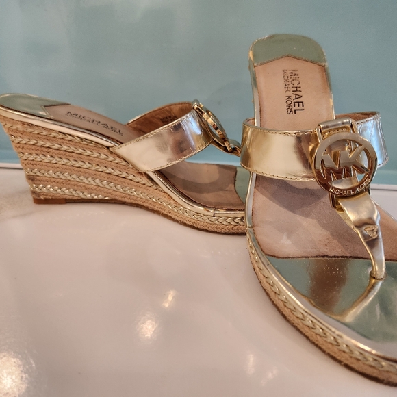 Michael Kors Shoes - Michael Kors Gold Espadrilles. Gold Wedge heel slip on dress sandals.